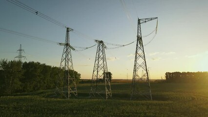 Wall Mural - High voltage power lines at sunset. Aerial view