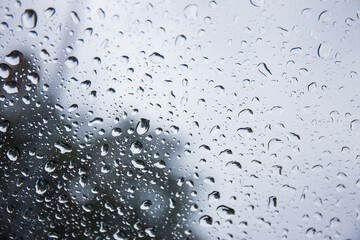 Fototapete - Raindrops on the background glass.