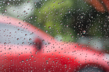 Fototapete - Raindrops on the background glass.