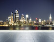 Empty concrete embankment on the background of a beautiful blurry New York city skyline at evening, mockup
