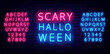 © Anastasia Gapeeva - Scary halloween neon label on brick wall. Season holiday emblem. Shiny blue and pinl alphabet. Vector illustration