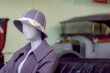 Vintage purple clothing on retro shop dummy. Mannequin lady driver