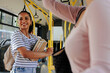 © bernardbodo - Smiling student on bus carrying books in arms