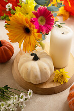 Stil Life Flowers And Pumpkin. Bouquet Of Fresh Flowers, Candle And Decorative Pumpkins. Autumn Colorful Abstract Background.