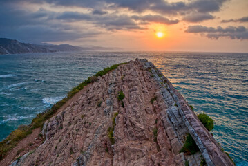 Wall Mural - sunset on the coast of zumaia with view of the flysch rocks 