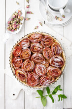 Traditional French Apple Tart Aux Pommes Bouquet De Roses Served As Top View On A Cake Plate