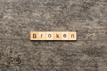 Wall Mural - BROKEN word written on wood block. BROKEN text on cement table for your desing, concept