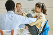 © Seventyfour - Side view portrait of Asian teenage girl in mental health support group sharing in circle