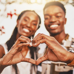 Canvas Print - Heart hands, emoji and love of couple smile, happy and showing kindness, trust and support. Closeup of young black people together in romantic relationship celebrate honeymoon with with content bond