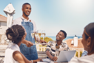 Restaurant, brunch and waiter with friends and champagne by table outdoor fine dining service. Customers eating at luxury catering party event by the ocean during the summer season