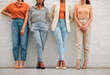 © Kay Abrahams/peopleimages.com - Creative and stylish team of business women against wall together, doing teamwork and collaboration at work. Shoes and legs of professional and corporate employees and workers working at a startup