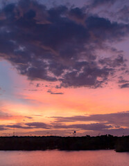 Wall Mural - dramatic pink and purple sunset lake reflection on woodlawn lake san antonio texas