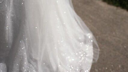 Wall Mural - glittery wedding dress of the bride in the sun