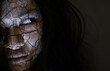 © sorapop - Scary ghost woman. Close up face of Asian woman ghost or zombie horror creepy scary have hair covering the face her eye at abandoned dark tone, female make up zombie broken face, Happy Halloween day