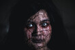 © sorapop - Bloody halloween makeup. Asian woman with blood eye she death and scary with blood tear on broken face, Close up horror bloodthirsty ghost female fade drop out from eyes, Happy halloween day concept