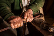 © ADDICTIVE STOCK - Crop senior man working with metal