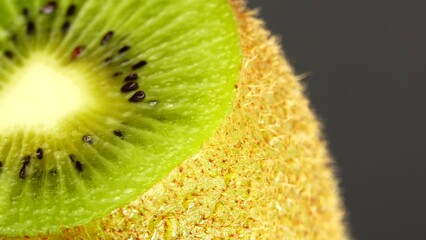 Wall Mural - 4K kiwi fruit. heap sliced and whole kiwi fruit close up, rotating