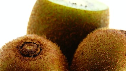 Wall Mural - 4K kiwi fruit. heap sliced and whole kiwi fruit close up, rotating