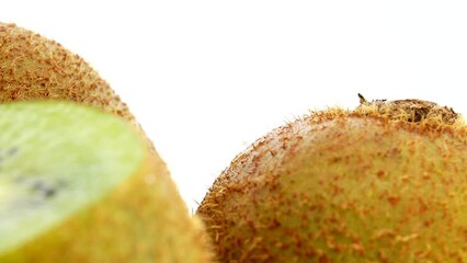 Wall Mural - 4K kiwi fruit. heap sliced and whole kiwi fruit close up, rotating