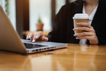 Businessman thai girl using laptop go shopping online in lunch break.