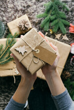 Closeup View Of Woman Hands Holding A Handmade Christmas Present