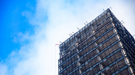 Close-up plan of construction site of apartment building made of metal structures and concrete partitions