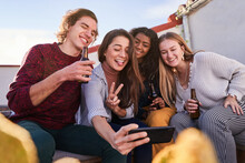 Joyful Diverse Friends Taking Selfie During Party On Terrace