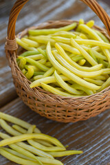 Canvas Print - yellow string beans in a wooden basket