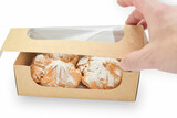 Fototapeta Kosmos - Disposable protective carton box with sweet baked goods after delivery