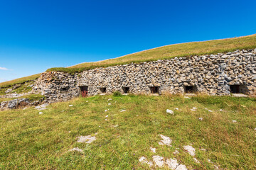 Wall Mural - Fortress or bunker of the second world war, Trekking footpath to the Mountain Peak of Osternig or Oisternig, Carnic Alps, Italy Austria border, Europe. Tarvisio, Udine province, Friuli Venezia Giulia.