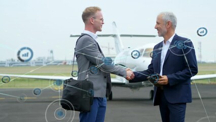 Sticker - Animation of network of digital icons over two caucasian businessmen shaking hands at the airport