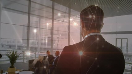 Sticker - Animation of glowing network of connections over rear view of businessman walking at office