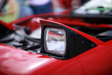 Retractable Headlight Close-up On A Red Sports Car