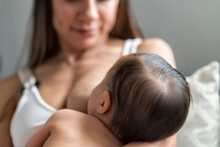 Content Mom Breastfeeding Baby At Home