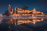 Fototapeta Na sufit - The main square in Krakow with a view of the cloth hall, St. Mary's Basilica in a natural mirror. Rynek główny w krakowie z widokiem na sukiennice, bazylikę mariacką w naturalnym lustrze.