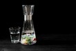 Healthy stones in a glass of water on the dark background