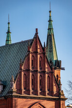 Brick Facade Of A Gothic Church In Kielce, Poland, During A Golden Hour