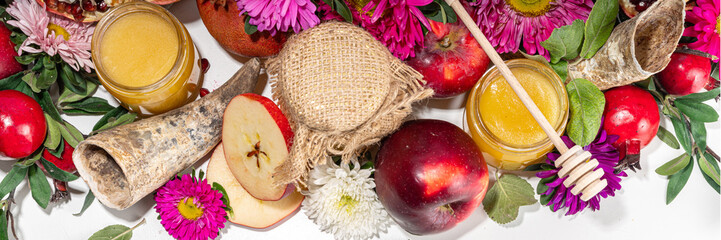 Happy Rosh Hashanah background. jewish New Year Rosh Hashana holiday postcard greeting background, with traditional religion symbols - apple, honey, pomegranate, shofar, flatlay copy space