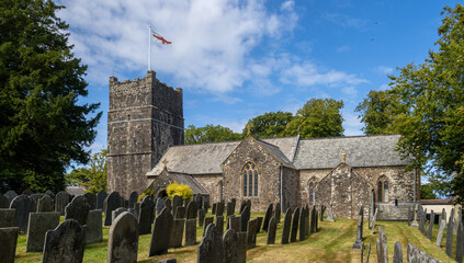 Clovelly church exterior, North Devon, England. Note gravestones unreadable.