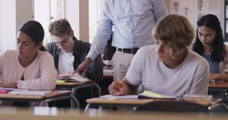 Wall Mural - Students in a classroom writing, learning and reading off a chalkboard with help from a teacher, professor or education worker. High school scholarship children or kids study and work on notebooks