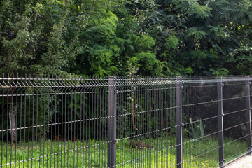 Wall Mural - Steel grating fence made with wire.
