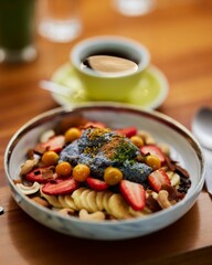 Wall Mural - White plate with breakfats with fruits and a cup of coffee on a bown table