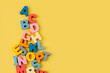 Colorful letters of the alphabet on yellow background. Primary school or preschool, kindergarten. Educational game. Learning through play.