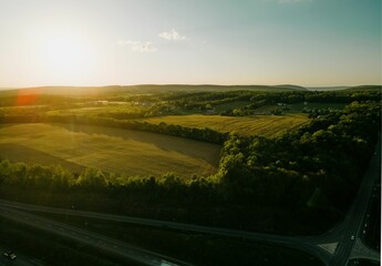 Sticker - Beautiful drone landscape over lush farm fields and highways under sunset sky in Pennsylvania