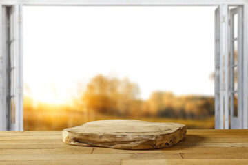 Wall Mural - desk of free space and autumn window background.