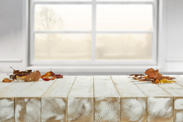 Wall Mural - Desk of free space and autumn window background. 