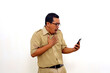 © ArvStd - Shocked Indonesian government employees standing while holding cell phone. Isolated on white