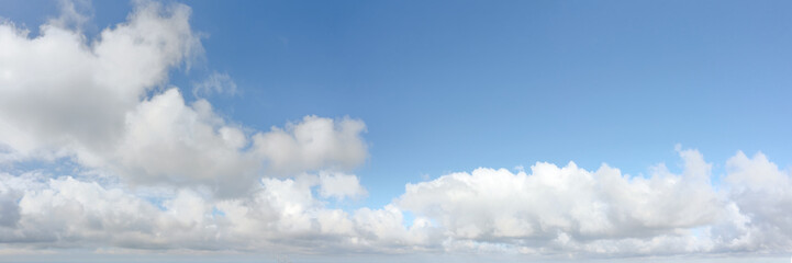 Wall Mural - clouds in the blue sky at the horizon panoramic view