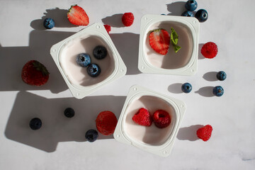 Wall Mural - Yogurt with strawberries, raspberries, blueberries
