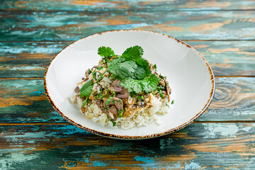 Poster - Fried rice with beef in Thai on wooden table